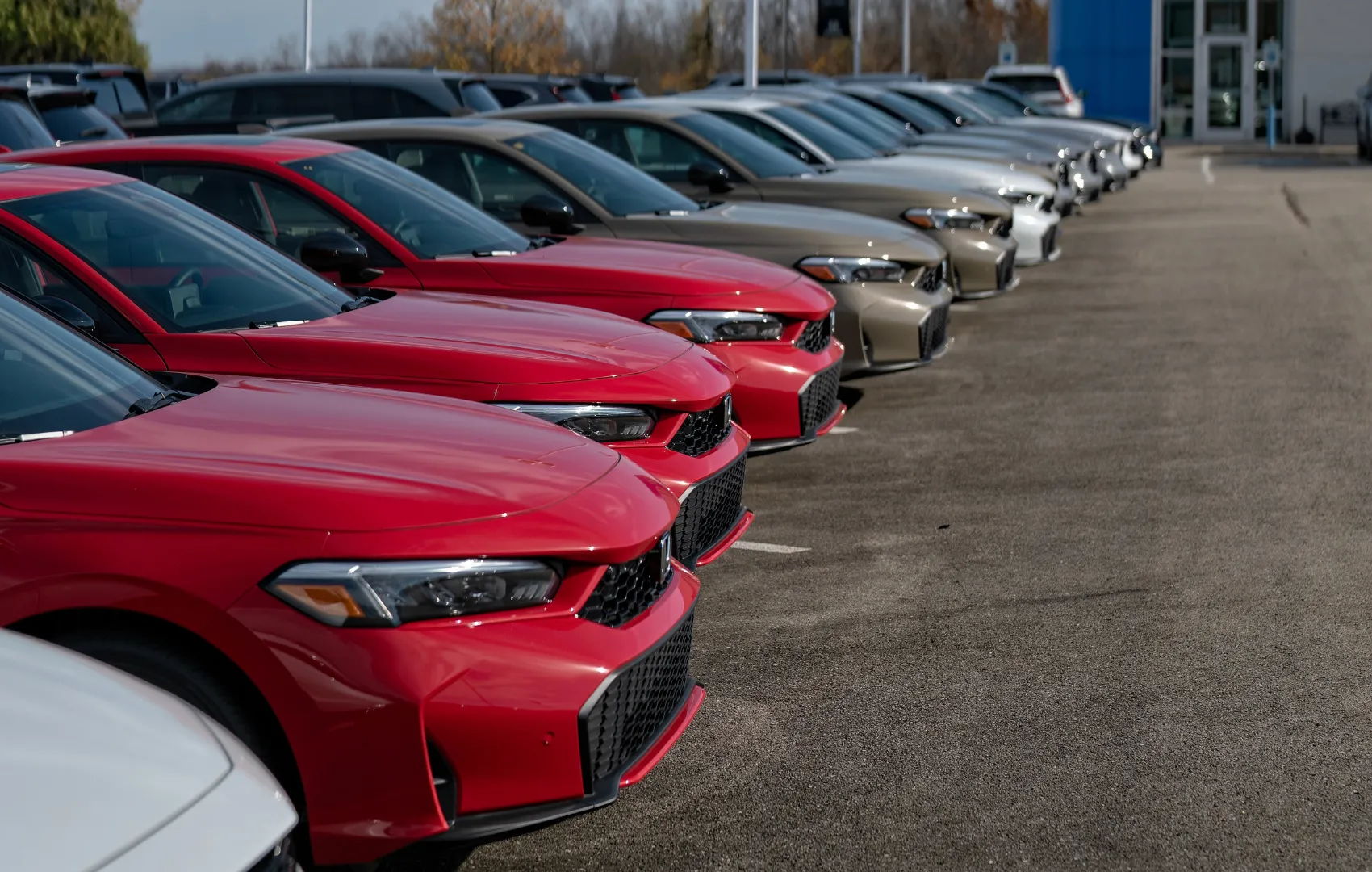 Honda Civics and Accords sitting in dealership lot